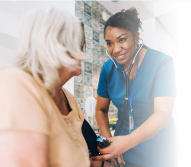 Nurse checking elderly patient's blood pressure